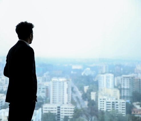 A businessman staring out of the window