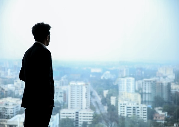 A businessman staring out of the window