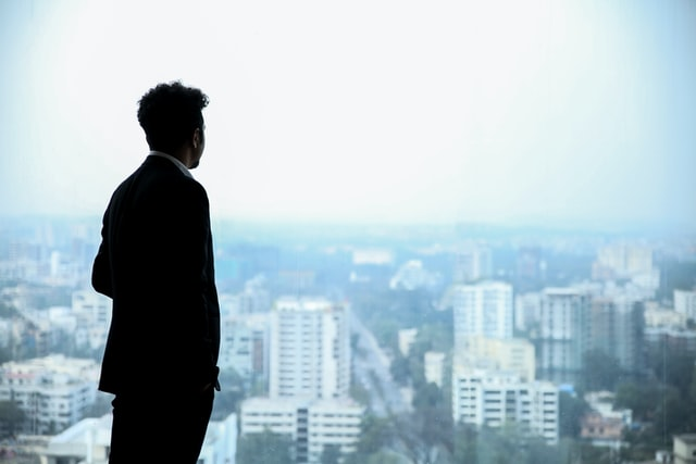 A businessman staring out of the window