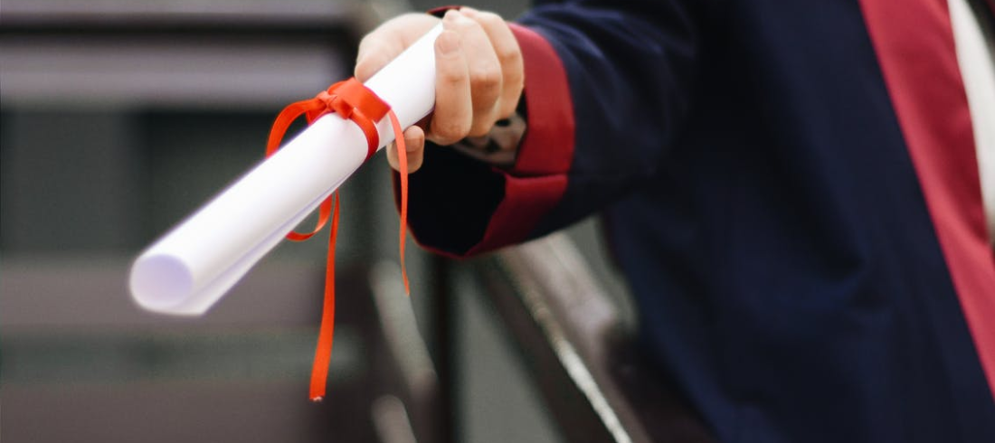 a person holding a diploma