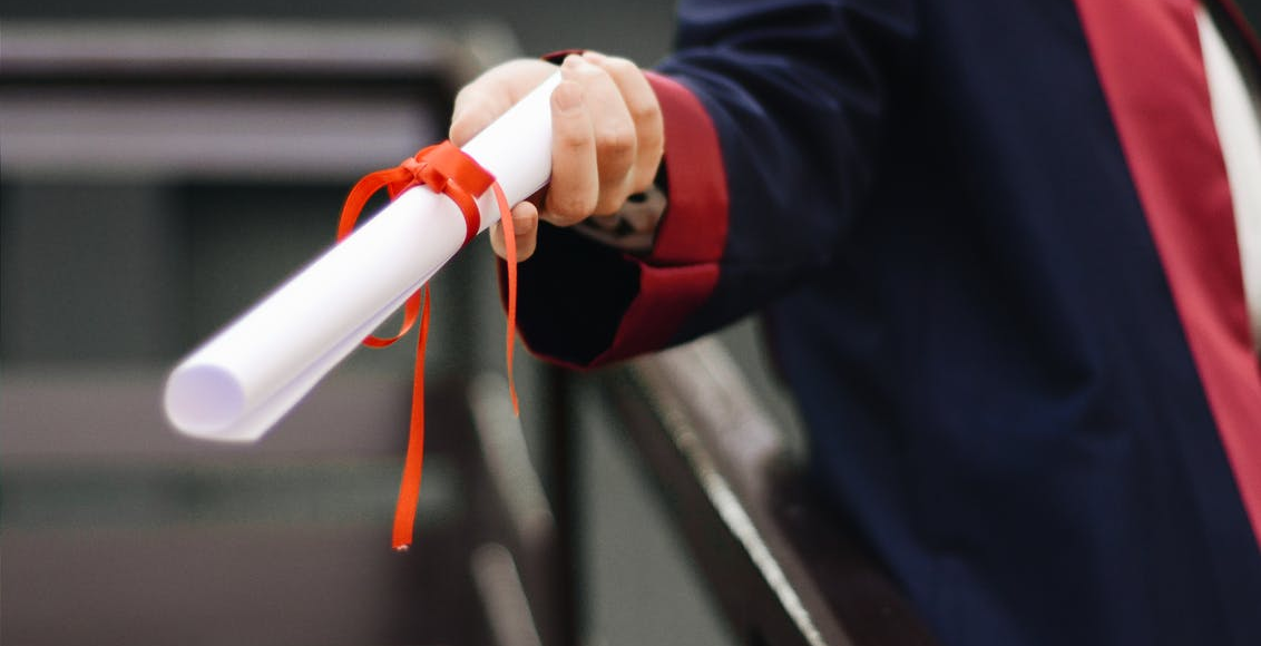 a person holding a diploma