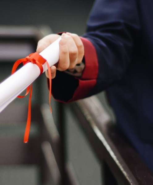 a person holding a diploma