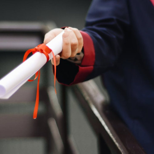 a person holding a diploma