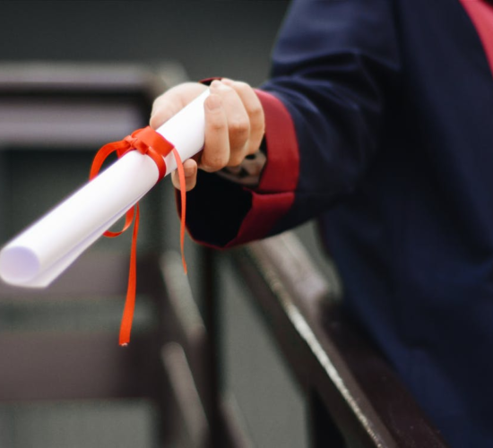 a person holding a diploma