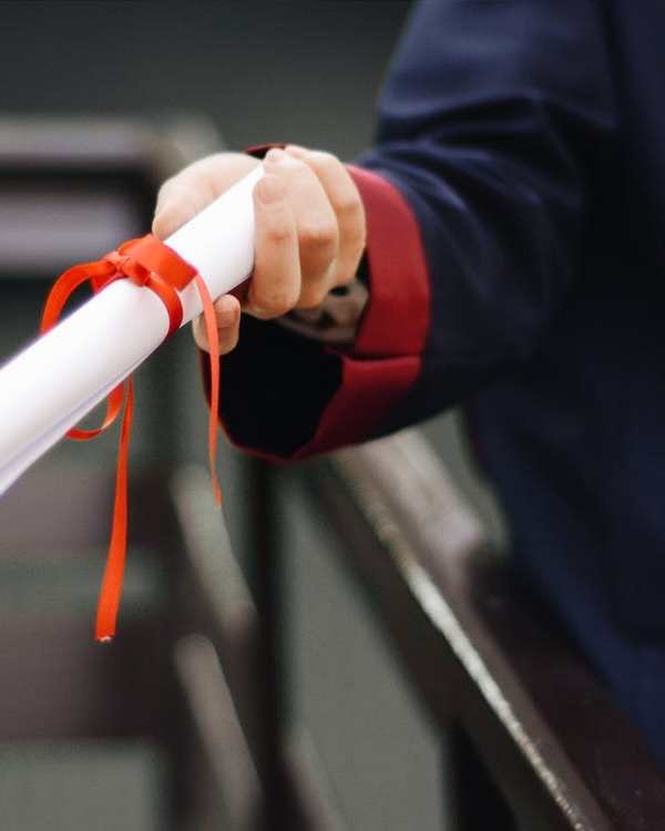 a person holding a diploma