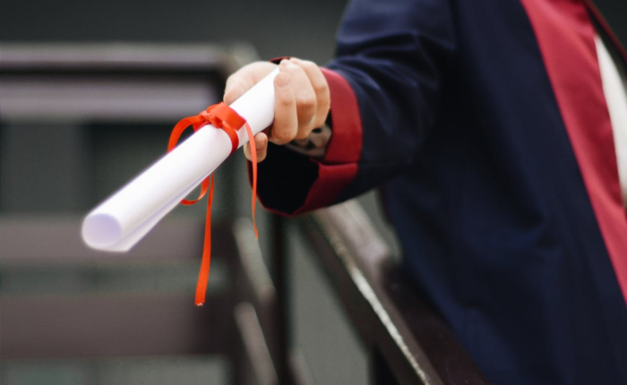 a person holding a diploma