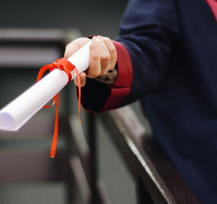 a person holding a diploma