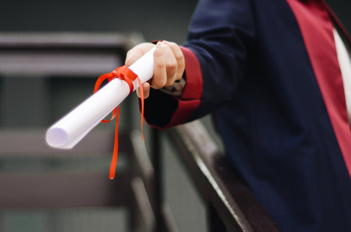a person holding a diploma