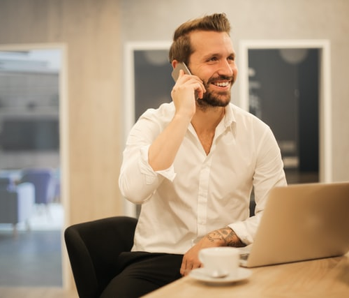 A business person on call with a laptop