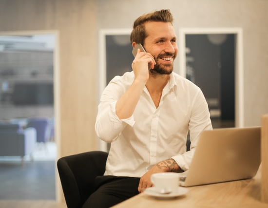 A business person on call with a laptop