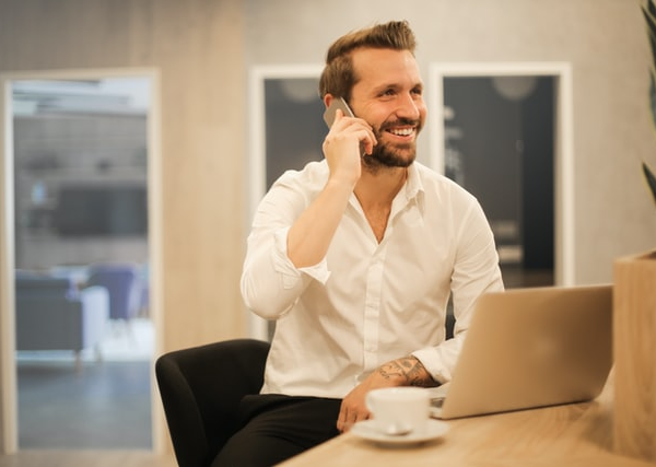 A business person on call with a laptop