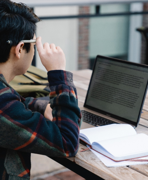 A man reading on his laptop