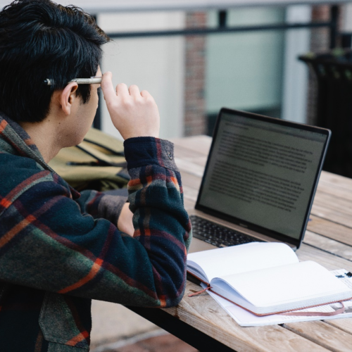 A man reading on his laptop