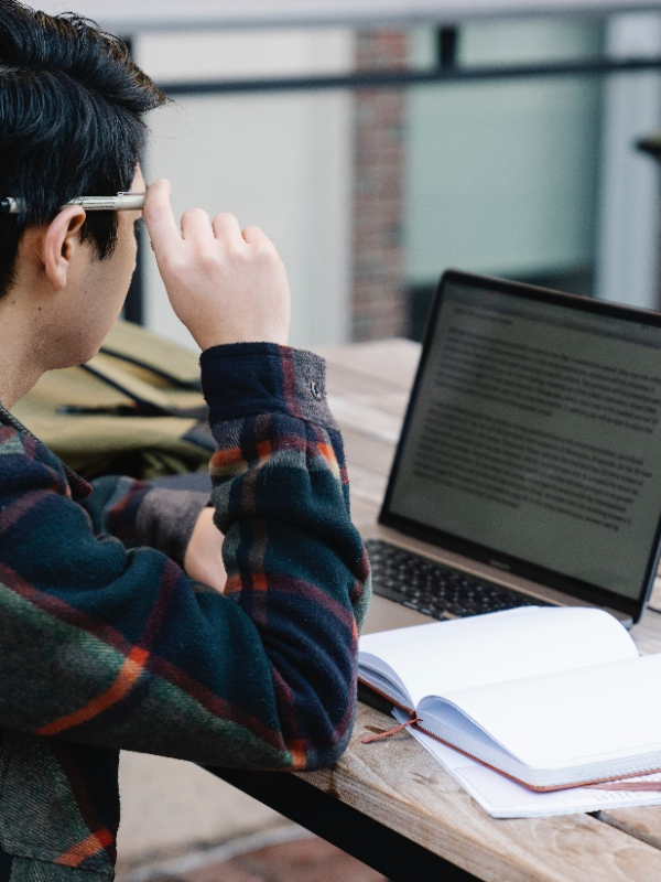 A man reading on his laptop