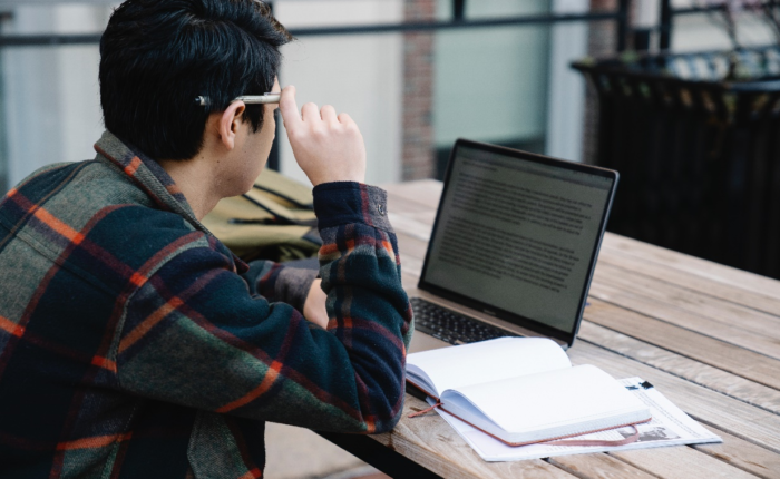 A man reading on his laptop