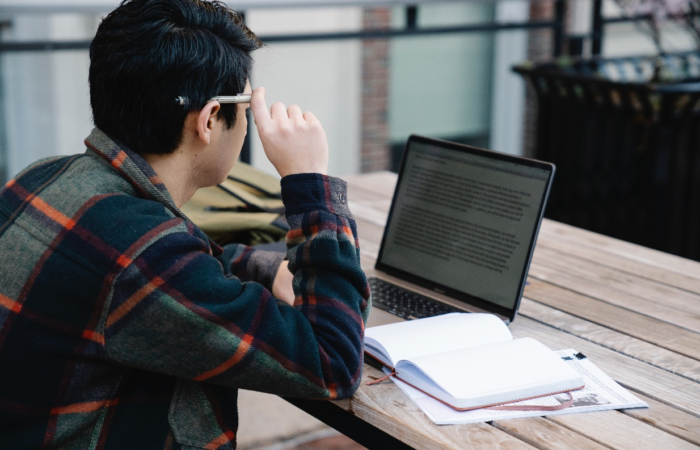 A man reading on his laptop