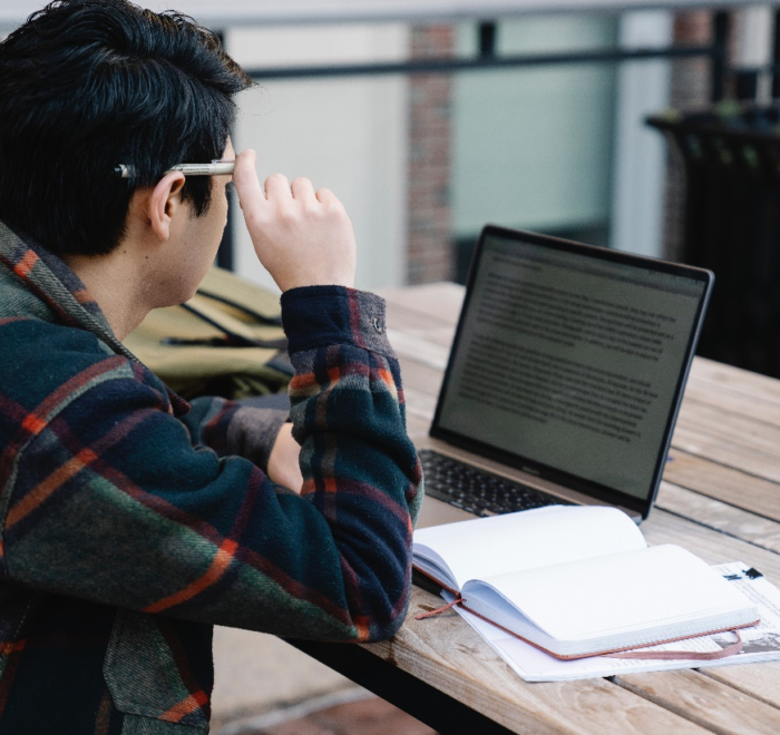 A man reading on his laptop