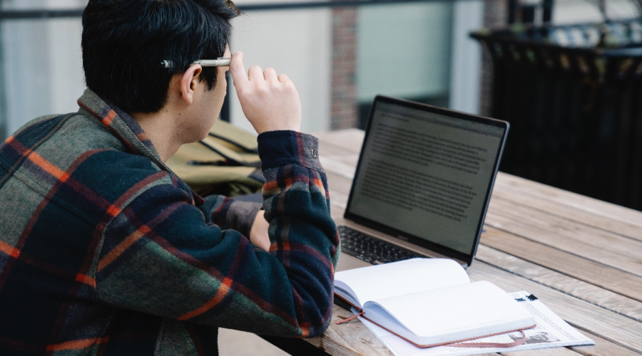 A man reading on his laptop