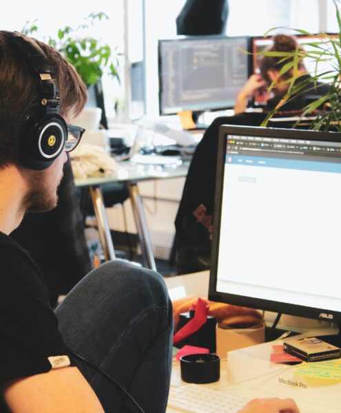 employees working in an open-concept office