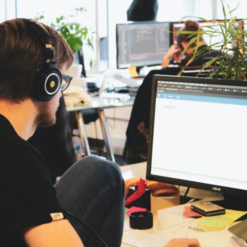 employees working in an open-concept office