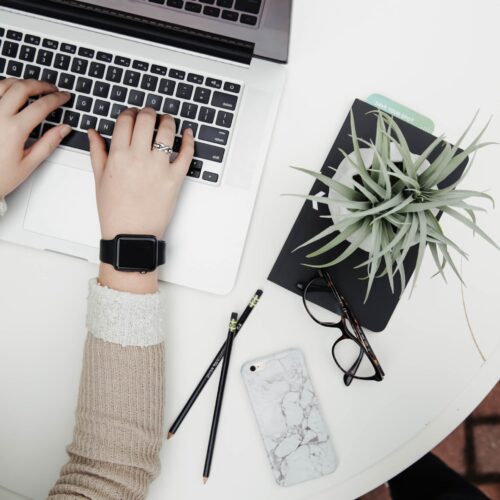 professional working on her laptop as a medical billing and coding