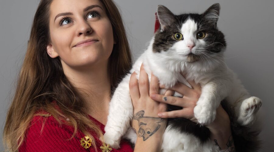 woman holding a rescue cat