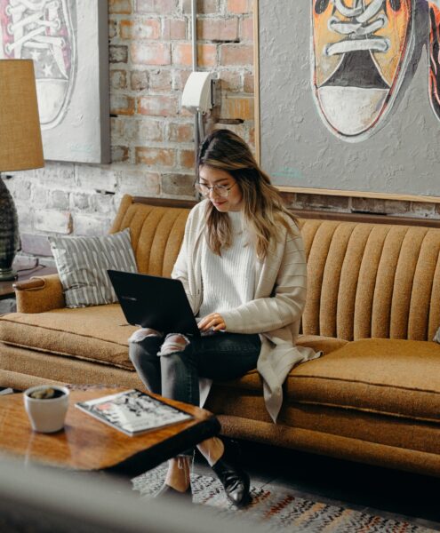 woman typing on a laptop