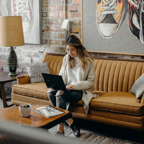 woman typing on a laptop