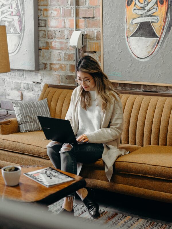 woman typing on a laptop