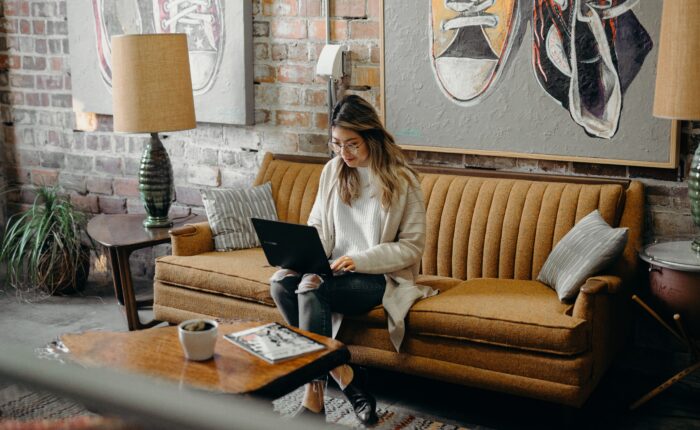 woman typing on a laptop