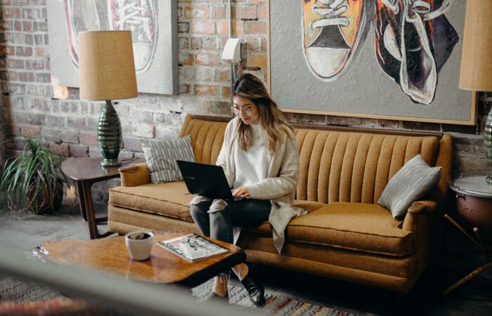 woman typing on a laptop