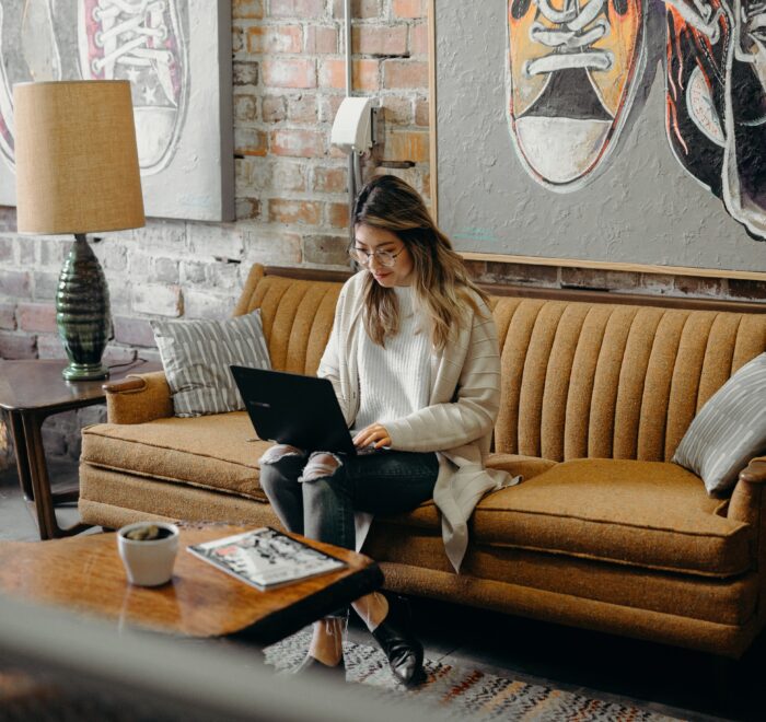 woman typing on a laptop