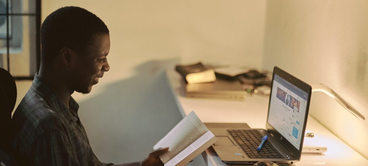 man studying at a laptop