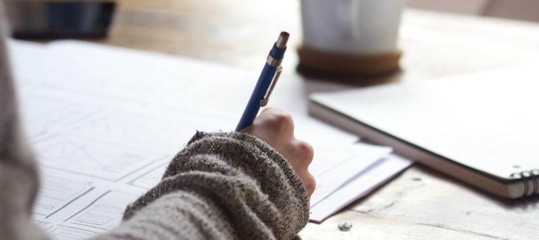 woman taking notes