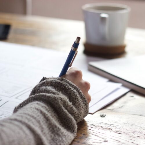 woman taking notes