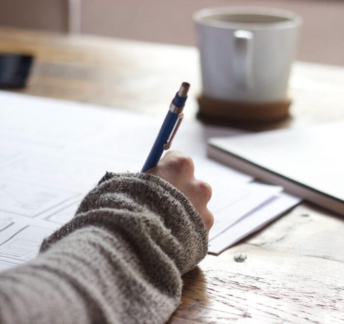 woman taking notes