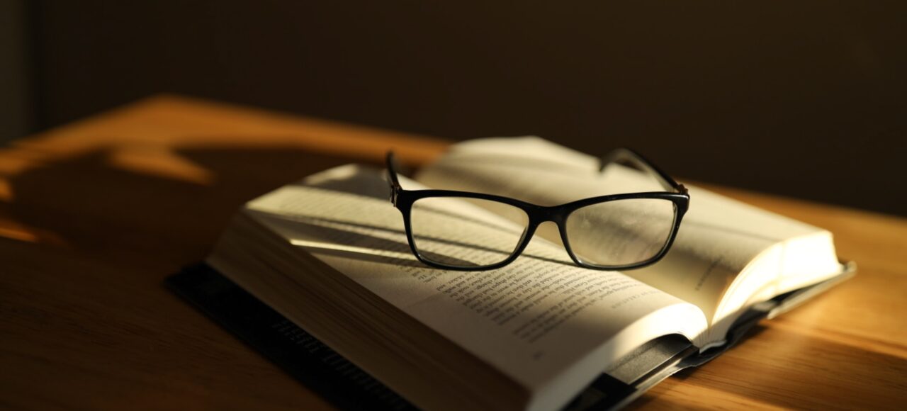 glasses on a textbook