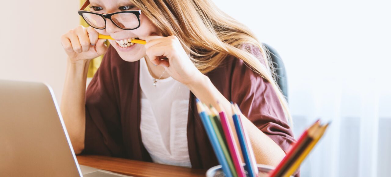 frustrated student biting pencil, wanting to drop that class