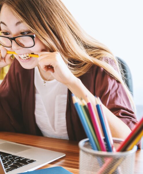 frustrated student biting pencil, wanting to drop that class