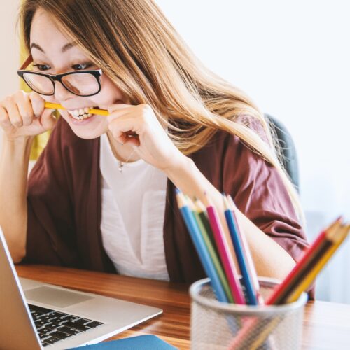 frustrated student biting pencil, wanting to drop that class