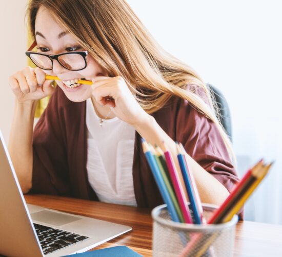 frustrated student biting pencil, wanting to drop that class