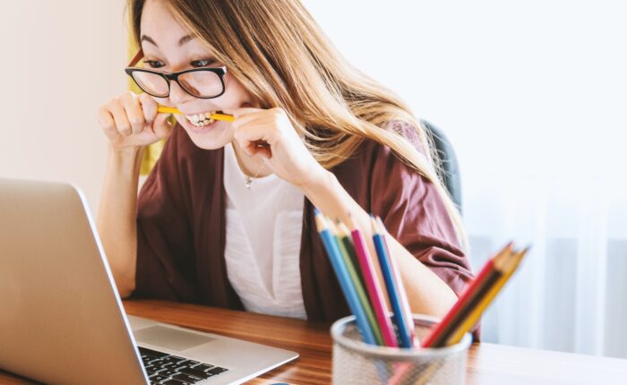 frustrated student biting pencil, wanting to drop that class