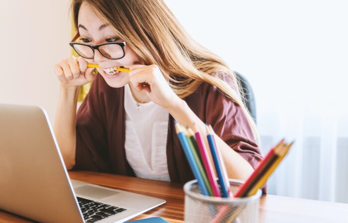 frustrated student biting pencil, wanting to drop that class