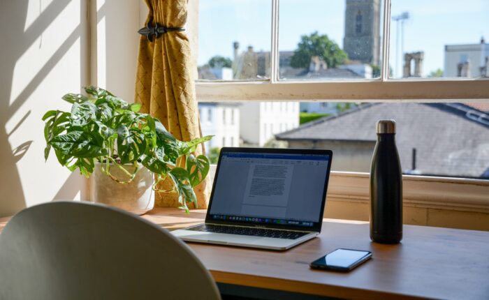 laptop set up in a home office for an online college student