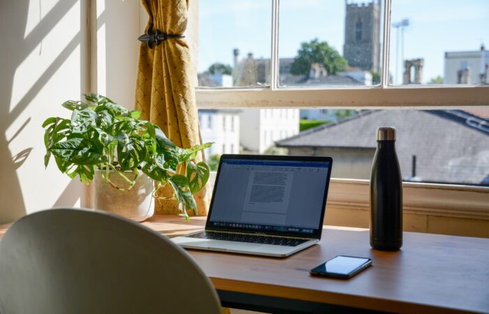 laptop set up in a home office for an online college student