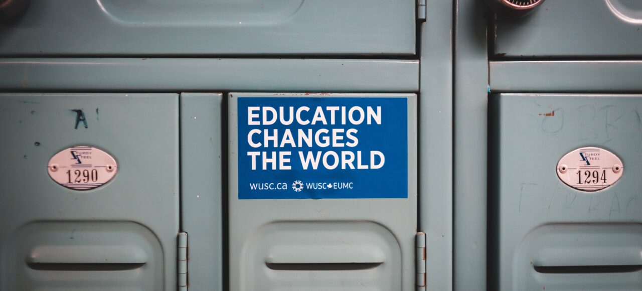 sticker that says education changes the world; benefits of higher education