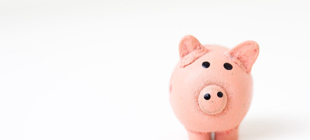 piggy bank; financial aid info on grants and scholarships
