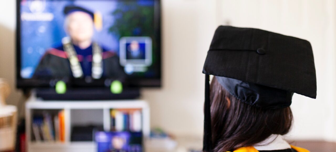 online student graduating virtually; online college builds independence