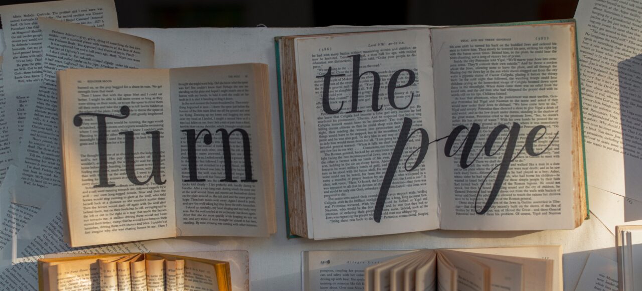 books with the words "turn the page" written on them