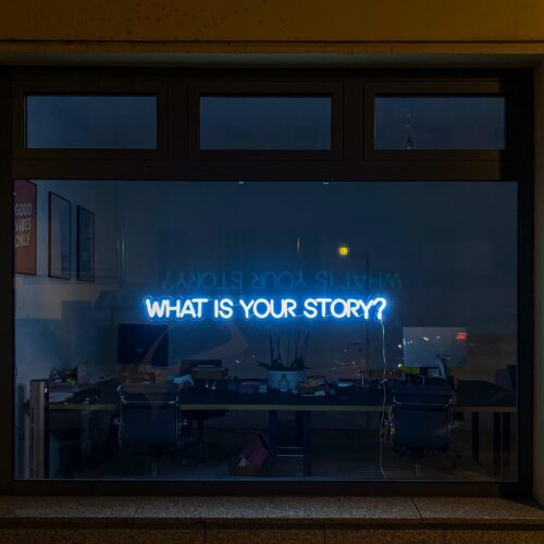 a sign that says "what's your story"